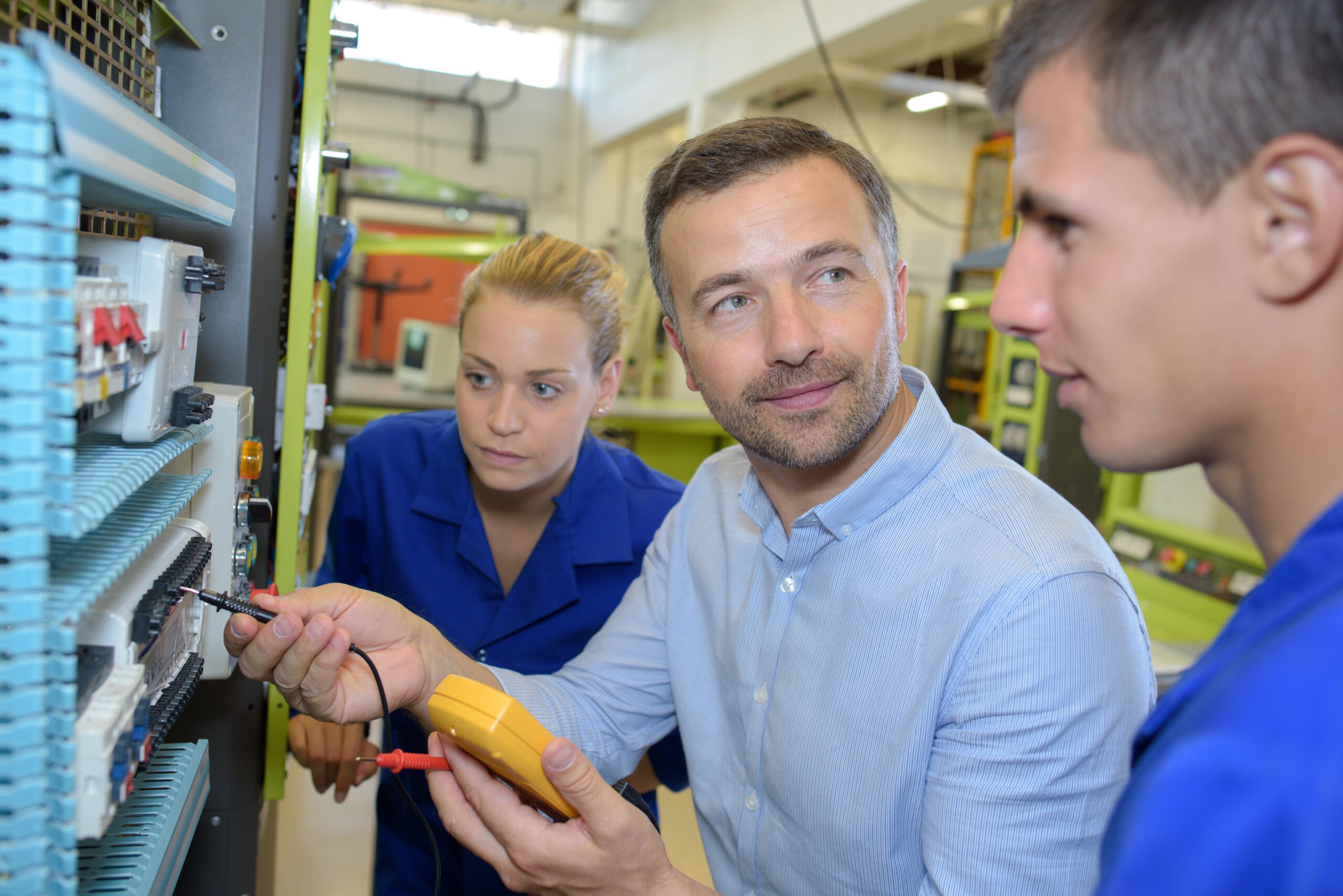 teacher with students in workshop
